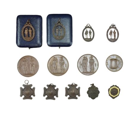 A group of National Rifle Association fob prize medallions and medals, together with an enamelled SMRC Daily Sketch Lady's Me