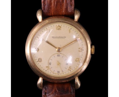A 1950s Jaeger-LeCoultre 9 ct gold wristwatch having a crown-wound Swiss movement and a circular frosted silver face with gil