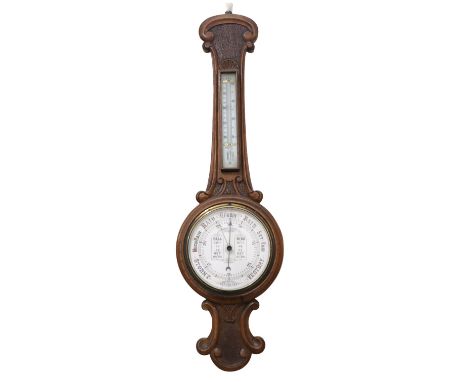 A Victorian carved blonde oak banjo barometer, having Admiral Fitzroy's indications, 90 cm