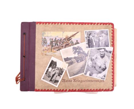 A German Third Reich soldier's "Meine Kriegserinnerungen" photograph album containing an associated group of photographs etc 