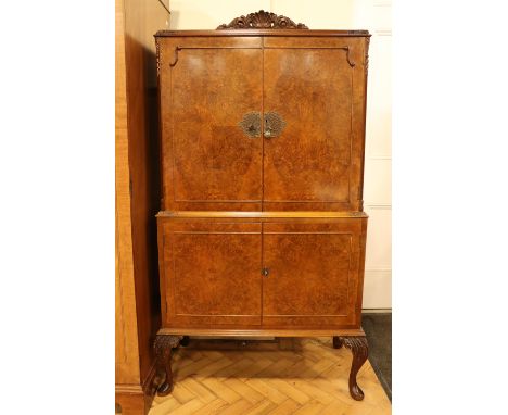 A mid-20th Century G&amp;F Golden Feather Products burr walnut veneered drinks cabinet, 90 cm x 44 cm x 159 cm 