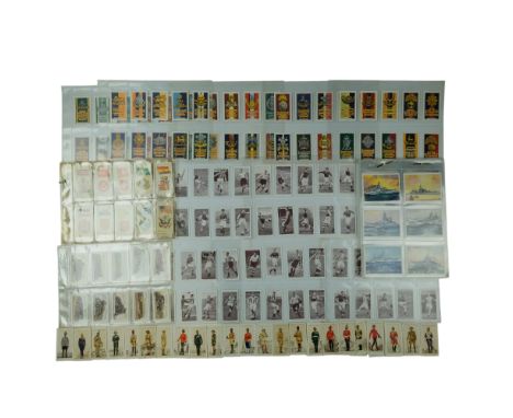 A group of vintage cigarette cards including Player's and Churchman's