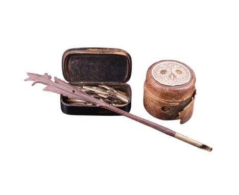 A Victorian travel inkwell, its lid faced with a relief composition plaque in the form of an owl, together with a Black Fores