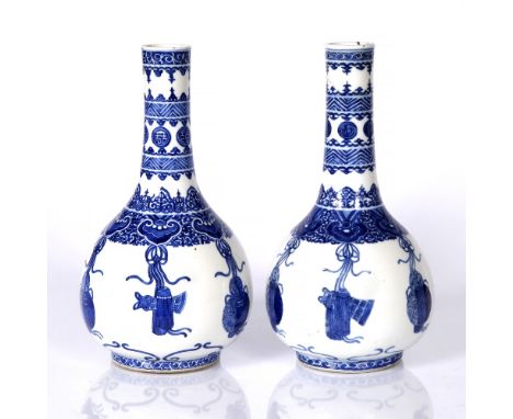 A pair of Chinese blue and white pear shaped bottle vases Kangxi mark but 19th Century the ovoid body with a band of Ling Chi