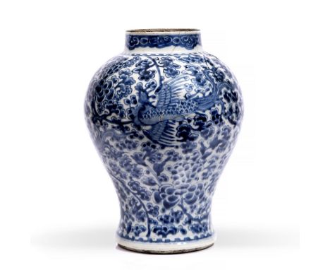 A Chinese blue and white porcelain vase 18th Century having phoenix and peony decoration with scroll border, 35cm high