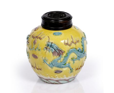 A Chinese ginger jar  Daoguang period of rounded form, decorated in high relief with turquoise and aubergine enamels with two