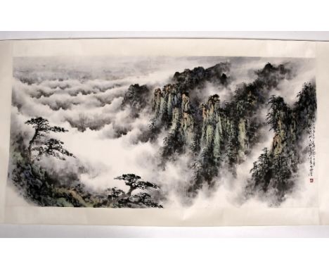 A Chinese scroll 20th Century a misty mountain landscape in a scroll box, with inscription and seal signature, 63cm x 130cm