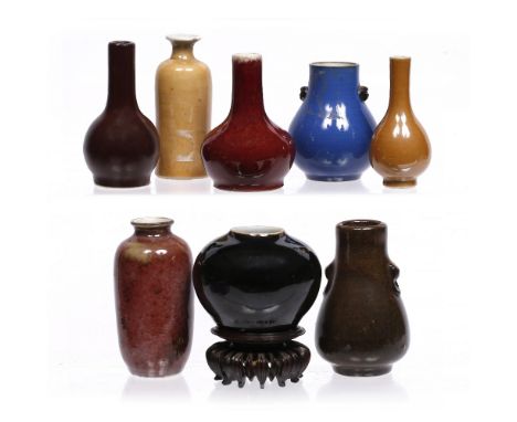 A Chinese group of miniature porcelain vases 18th/19th Century a compressed rounded jar shaped vase with famille noir mirror 