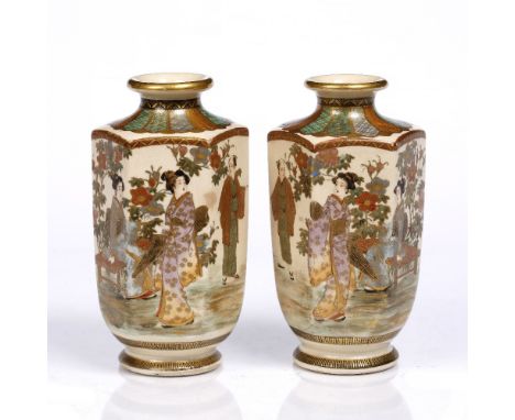 A pair of hexagonal bodied vases late Meiji with short trumpet-mouth, decorated figures of ladies and a gentleman seated and 