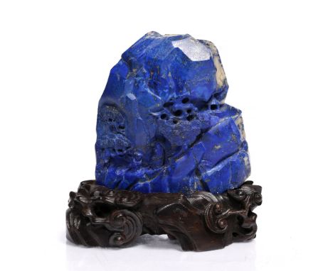 A lapis lazuli boulder scholar's desk ornament 19th Century carved as an Immortal and attendant walking up a mountain path am