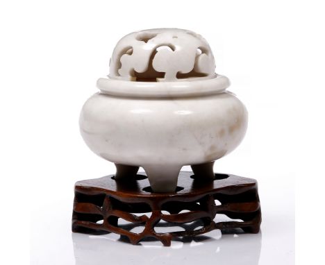 A Chinese mottled white ting and cover 19th Century on tripod feet, cover with open work scroll and leaf shaped motifs, 12cm 