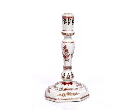 A Chinese export porcelain candlestick Qianlong modelled after an English silver example, the octagonal base and baluster sti