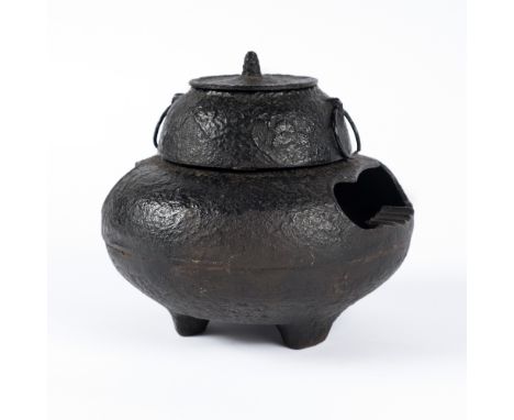 A Japanese iron 'ghost' kettle Meiji period with ring handles, 18cm