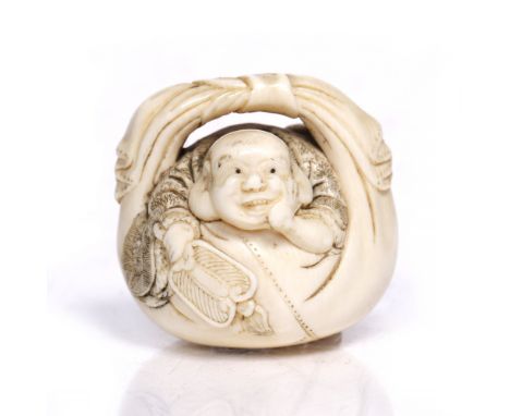 A Japanese ivory netsuke  19th Century of Hotei partially resting upon the folds of his sack while holding a fan and resting 