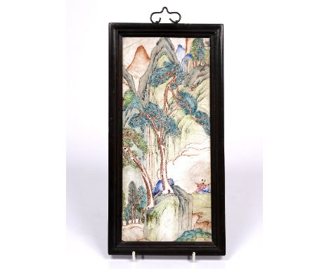 A Chinese Canton enamel panel 19th Century painted with immortals sitting admiring a mountain highlighted by scattered pine t