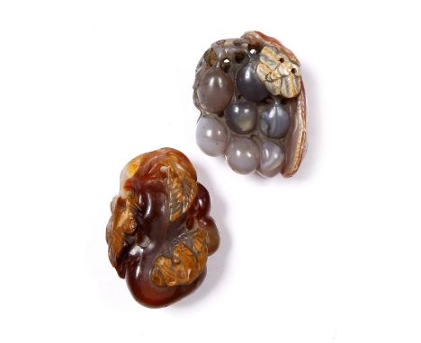 A Chinese mottled brown and blue agate pebble  19th Century pierced and carved as a butterfly on a branch of grapes, 5cm and 