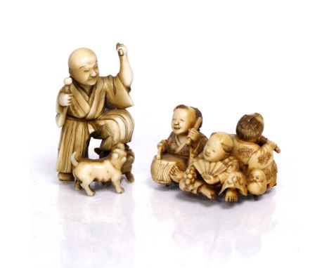 A Japanese ivory netsuke  19th Century of a standing blind man gesticulating as he meets with two dogs, signed Jugyoko, Tokyo