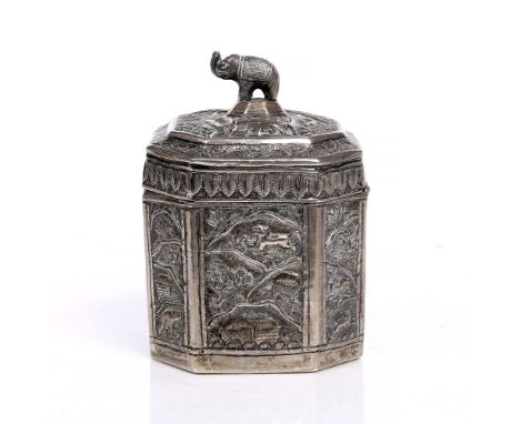 An Indian silver metal caddy 19th Century with elephant finial and panels of other animals and various buildings, 11.5cm high