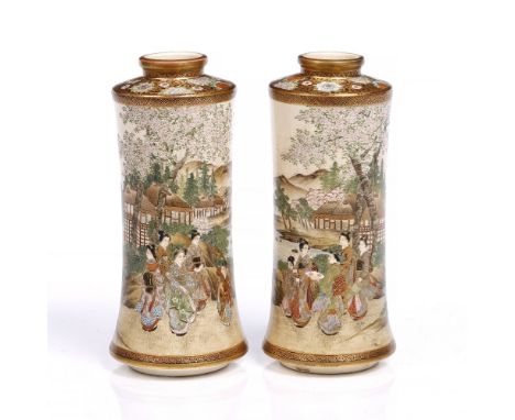 A pair of Japanese Satsuma vases late Meiji period of waisted cylindrical form decorated families enjoying the grounds of a l