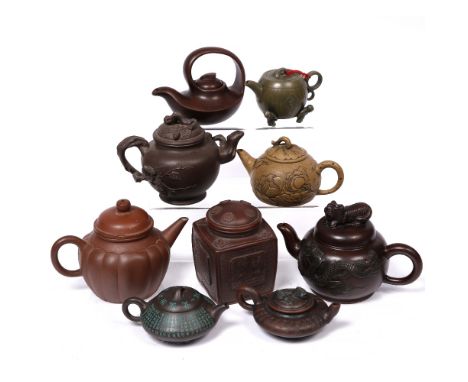 A collection of eight Yixing teapots and a Yixing tea caddy (9)