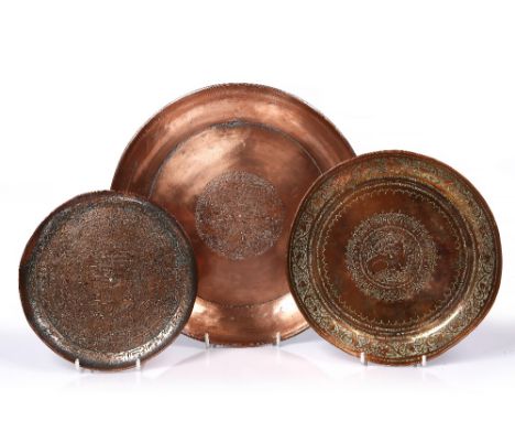A Safavid tinted copper magic plate 19th century engraved to the side with owners name (Lady Noba), 26cm diameter, together w