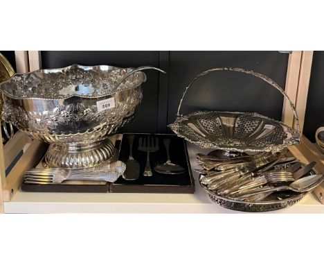 A Shelf of silver plated and E.P Wares; Large ornate punch bowl with ladle, ornate swing handle basket, large selection of fl