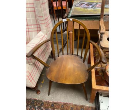 A dark Ercol  arm chair 
