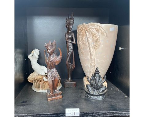 A Shelf of Eastern deities figures, Beswick palm tree vase along with Moore and co style cherub figure as found 