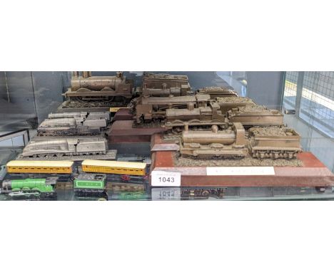 A Shelf of train sculpture models. Royal Hampshire The Mallard Makers of Fine Art Miniatures and Canadian National Railways '