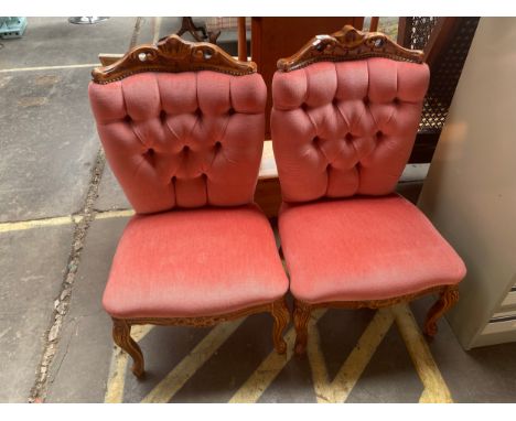 A Pair of Reproduction button backed chairs 