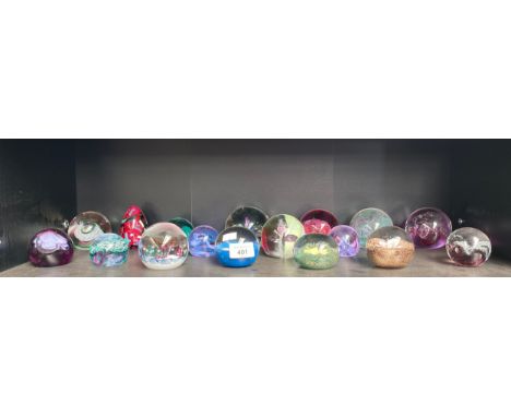 A Shelf of Caithness paperweights 