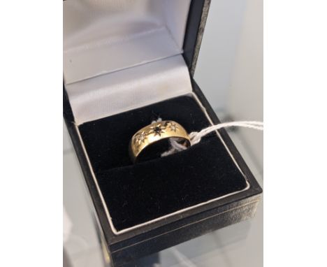 9ct yellow gold wedding band ring set with a single sapphire and two diamond stones. [Ring size K] [3.21Grams] 