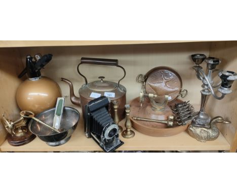 A shelf of collectables to include brass and copper ware, e.p.n.s candlestick, Kodak Six20 camera and a Sparkles Globemaster 