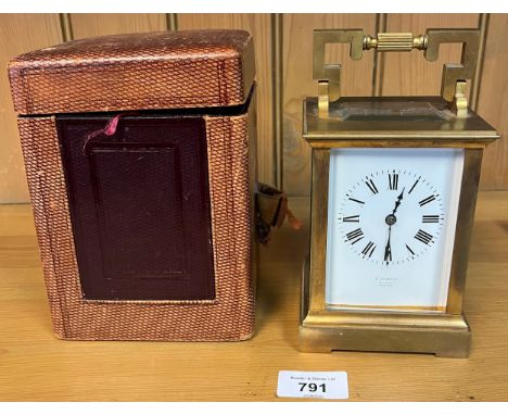 A Large 19th century brass carriage clock- R. Stewart- Glasgow- Paris made. Comes with leather travel case and key. In a work