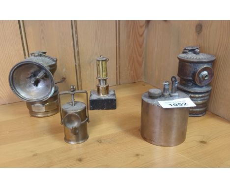 A lot of 5 antique and vintage lanterns and lighter; minors lamp sculpture, Bike lantern sculpture, two bike lanterns and hea