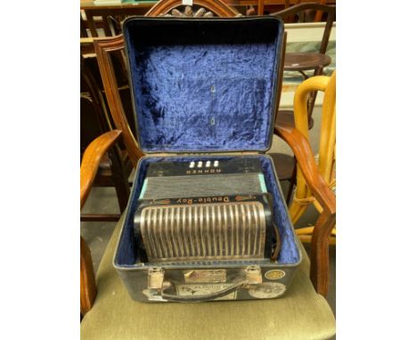 A Hohner Double Ray accordion with case 