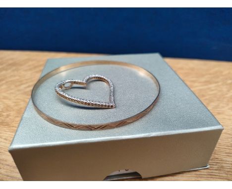 9ct yellow gold bangle together with a 9ct yellow gold and cz stone heart shaped pendant. [6.91Grams] 