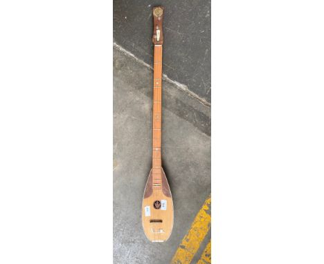 An Eastern themed 3 string musical instrument 