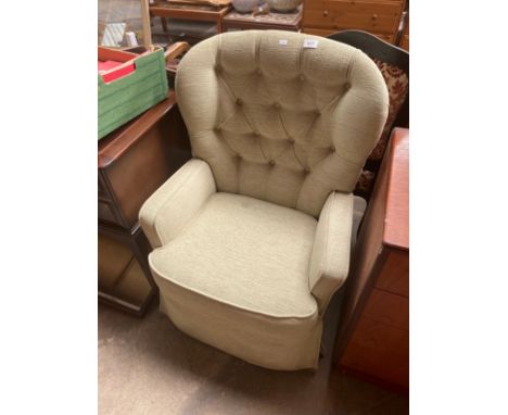 A Mid century button back arm chair 