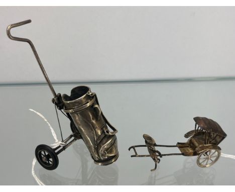 London silver miniature golf trolley model together with white metal rickshaw model. 