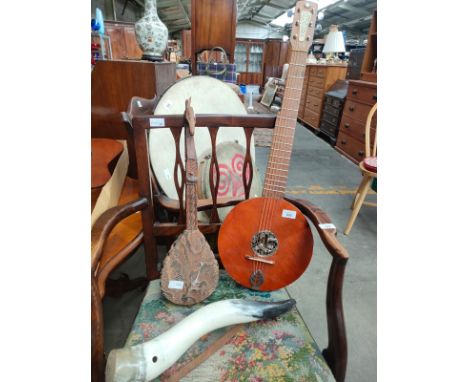 A Selection of musical instruments includes eastern 6 stringed Harp guitar 