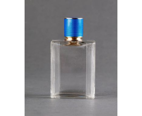 Glass perfume bottle with silver gilt and blue and white enamel lidsigned 'JC Cartier London’English hallmark, date letter fo