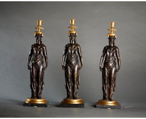 The central part features a caryatid topped by a candlestick, resting on a circular base with a square black marble base. H. 