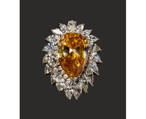 Platinum ring set with a pear-shaped Fancy Deep Brown-Yellow diamond weighing approximately 8.31 carats, surrounded by round 