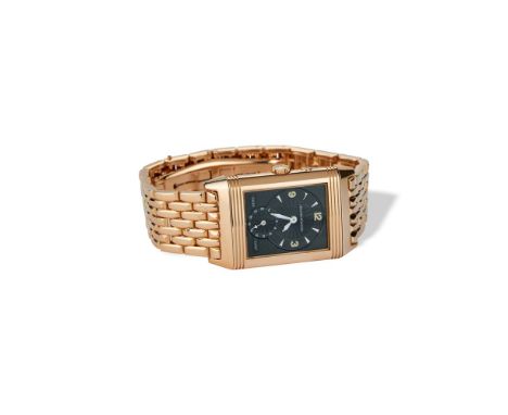 signed rectangular dial, small second hand at 6 o'clock. Second 'night and day' dial with separately adjustable dual time zon