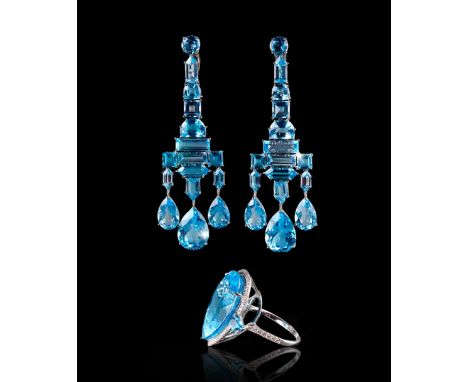 Girandole earrings with blue topaz in 18k white gold mount Ring with blue topaz D. 0.95 cm, in 18k white gold mount Gross wei