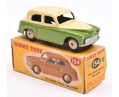 Dinky Toys Hillman Minx Saloon (154). An example in cream and light green, with cream wheels and black tyres. Boxed- with gre