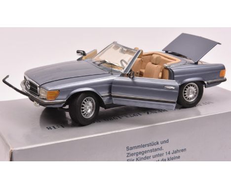 A CMC 1:18 scale Mercedes-Benz 450SL. An example in light metallic blue with fawn interior. Boxed, minor wear. Vehicle GC-VGC