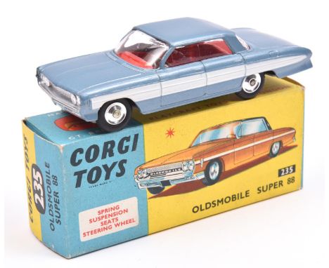 Corgi Toys Oldsmobile Super 88 (235). An example in light metallic steel blue with white flash and red interior, dished spun 