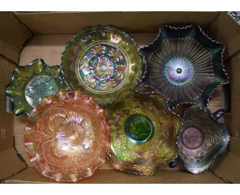 A collection of darker coloured carnival glass item to include: commemorative plates, footed bowls, ruffled edge pieces etc 